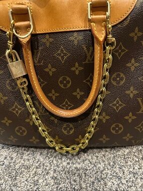 Gold Bag Chain with LV Lock and Key.